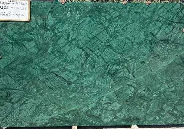 verde guatemala marble slab with intricate patterns