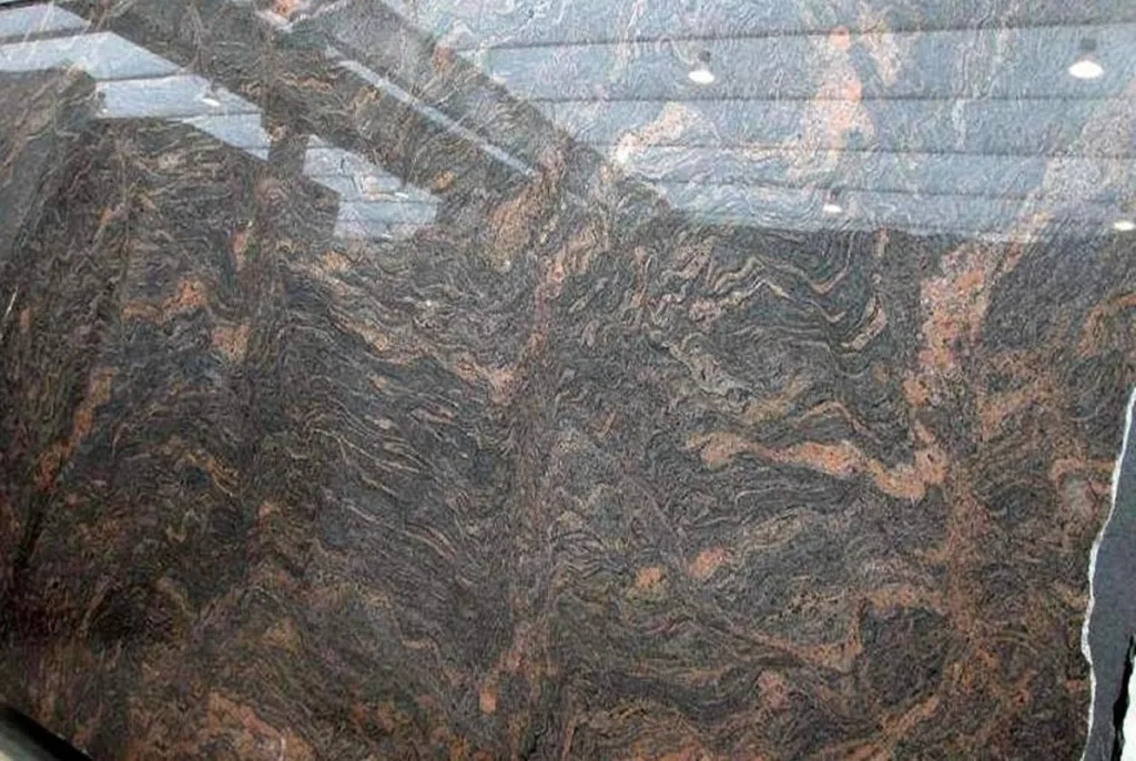 Dark polished Bash Paradiso granite with wavy patterns.